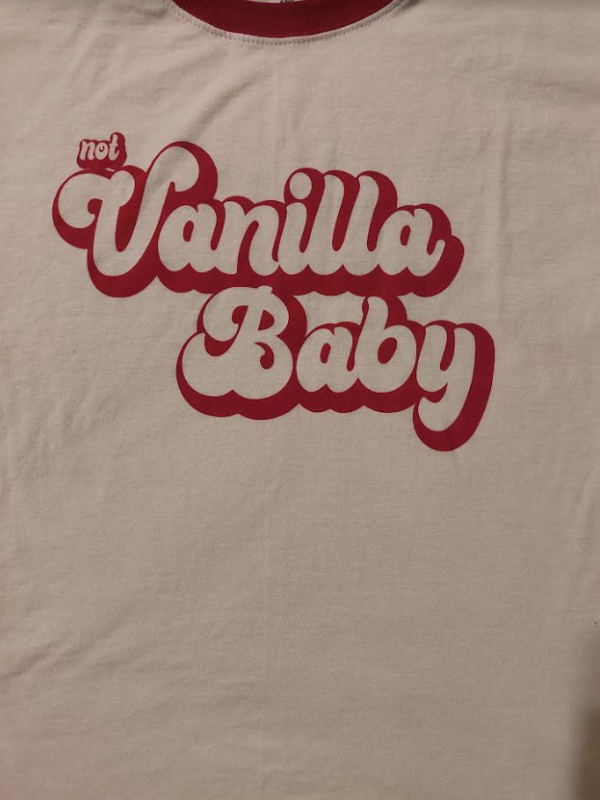 Up close image of t-shirt writing/design says "not vanilla baby"