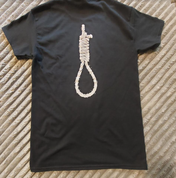 Image has a hangman's noose on the back of a t-shirt laying on a background.